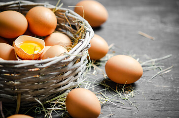 Fresh chicken eggs in basket.