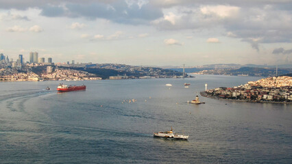 Aerial top view Container ship full load container on the green sea with beautiful wave pattern for logistics , shipping , import export or transportation.