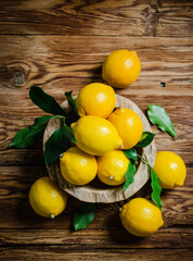 Fresh lemons. On wooden table.