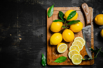 Obraz na płótnie Canvas Fresh lemons. On cutting board.