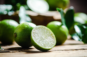 Fresh limes. On wooden table.
