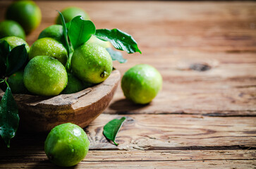 Fresh limes. On wooden table.