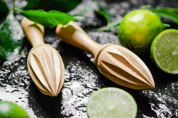 Fresh limes. On black table.