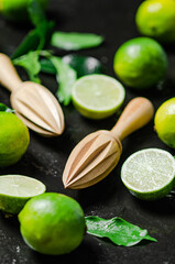 Fresh limes. On black table.