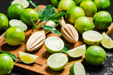 Fresh limes. On black table.