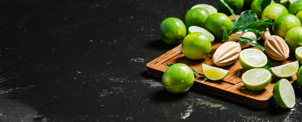 Fresh limes. On black table.