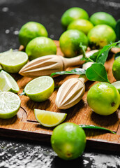 Fresh limes. On black table.