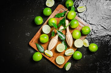 Fresh limes. On black table.