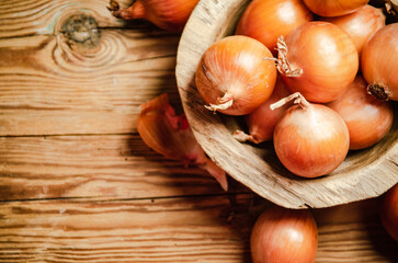 Fresh onions . On table.
