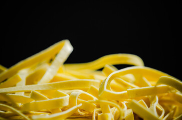 Homemade pasta tagliatelle .