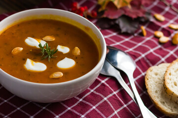 pumpkin soup. on a wooden background. gourmet. lunch .season
