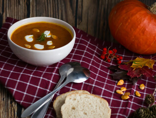 pumpkin soup. on a wooden background. gourmet. lunch .season