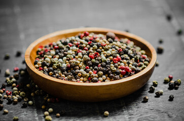 Peppercorn on rustic background.
