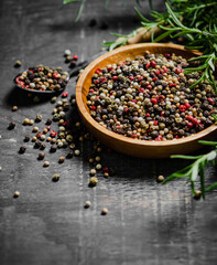 Peppercorn on rustic background.