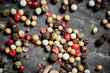 Peppercorn on rustic background.