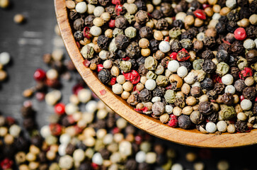 Peppercorn on rustic background.