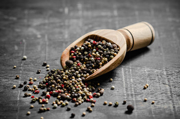 Peppercorn on rustic background.