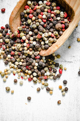 Peppercorn on rustic background.