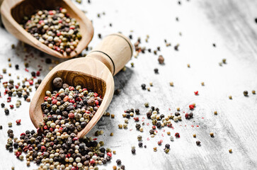 Peppercorn on rustic background.