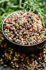 Peppercorn on rustic background.