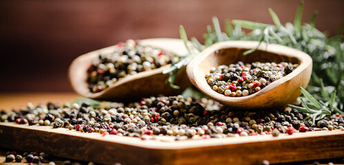 Peppercorn on rustic background.