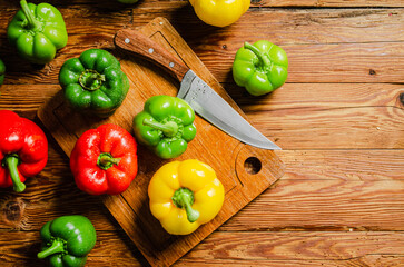 Fresh sweet pepper. On wooden table.