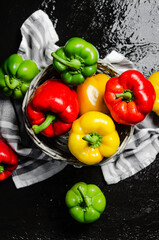Fresh sweet pepper. On black table.