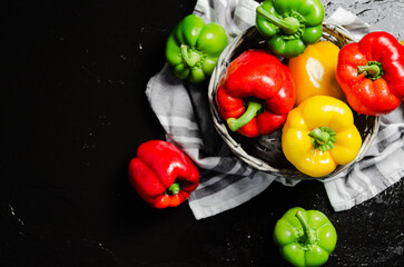 Fresh sweet pepper. On black table.