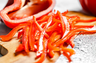 Chopped sweet pepper. On white table.