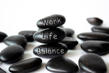 Work life balance text engraved on white stones. Life balance concept.