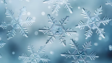 Schilderijen op glas Voluminous white snowflake on a blue background © Taisiia