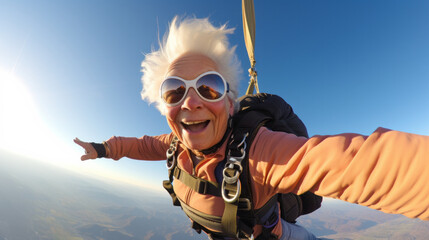 Happy old mature woman taking selfie picture while sky diving - obrazy, fototapety, plakaty