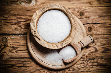 Salt background . On wooden table.