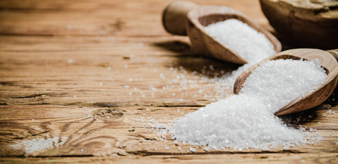 Salt background . On wooden table.