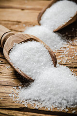 Salt background . On wooden table.
