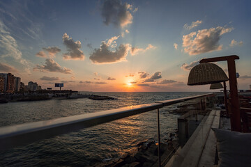 Spectacular sunset sky with clouds from cafe terrace in Alexandria Egypt