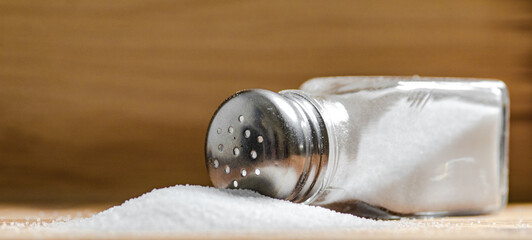 Salt background . On wooden table.