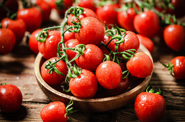 Fresh tomatoes. On wooden table.