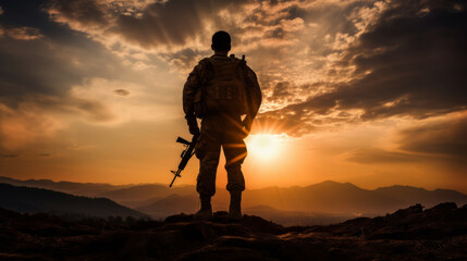 Graphic silhouette of armed soldier or marine at sunset..War concept. - obrazy, fototapety, plakaty
