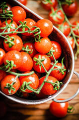 Fresh tomatoes. On wooden table.