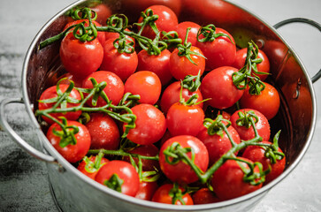 Fresh tomatoes. On white table.