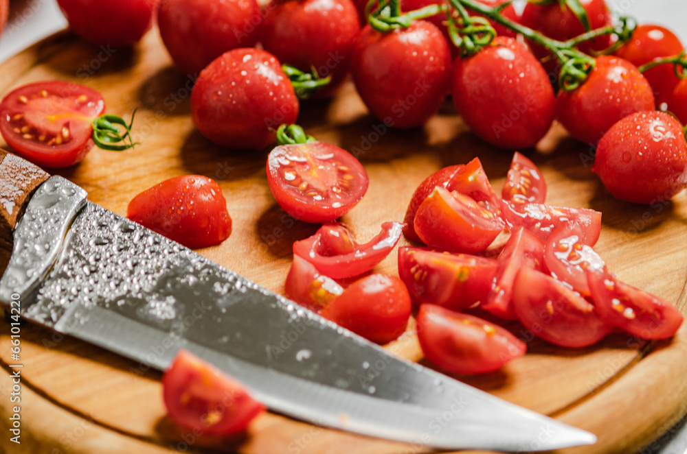 Wall mural fresh chopped tomatoes. on cutting board.