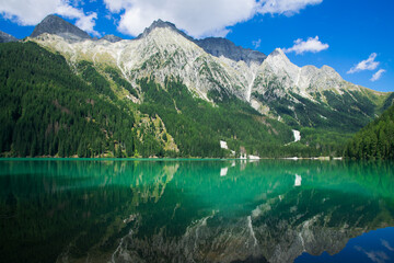 Magic landscape with peaceful alpine lake in Trentino Alto-Adige, Italy