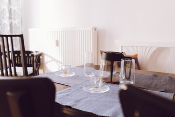 empty glass coffee cups and coffee pot on tabletop