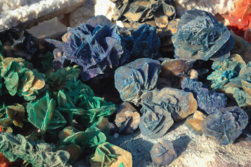 Saharan gypsum desert roses for sale on a stall on road across Chott El Jerid endorheic salt lake, Tunisia