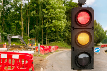 Close-up of the temporary portable traffic light installed to manage traffic flow during roadworks