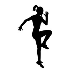 Fototapeta na wymiar Silhouette of a sporty female doing workout. Silhouette of a slim woman athlete in action pose doing exercise.