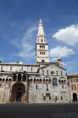Fototapeta na wymiar Modena, Italy. View of Cathedral with Ghirlandina tower located on Piazza Grande at dusk