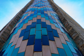 On the side of the wall is a beautifully constructed tower of longitudinal slabs