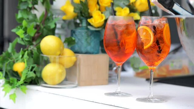 The bartender prepares a cool drink, Aperol
